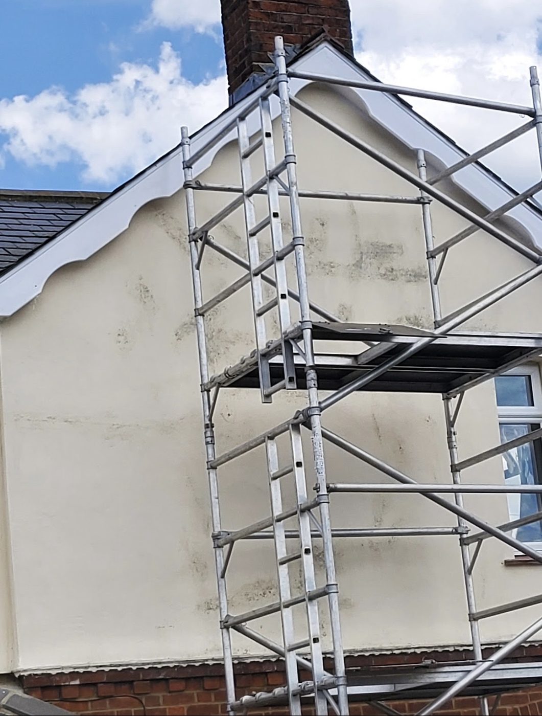 The same gable with the bargeboards made good and repainted clean white
