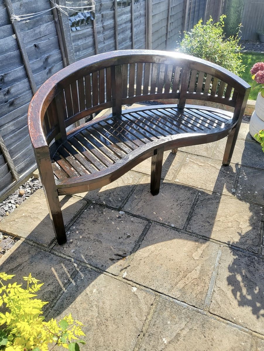 The same bench re-finished in an even, deep sheen