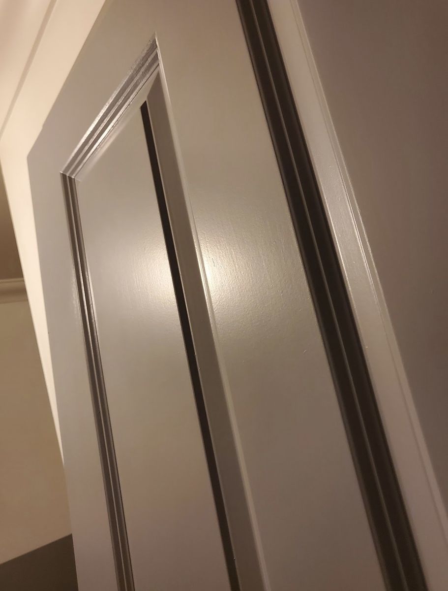 Close-up of the finished door and frame, showing a flawless sprayed edge