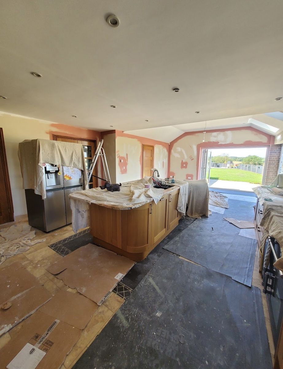 Kitchen masked and prepped, ready for spraying