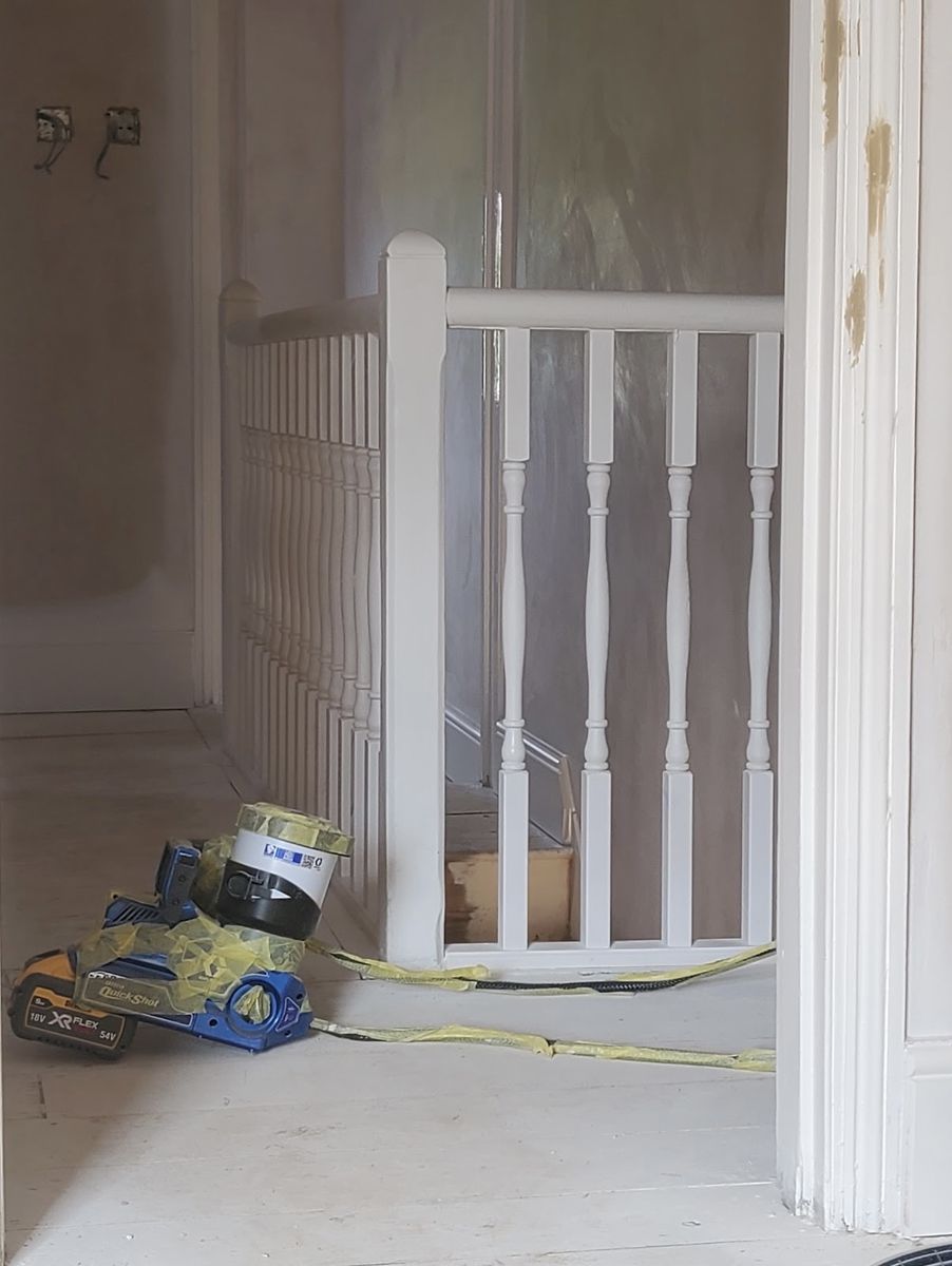 Landing spindles and newel posts, painted by hand
